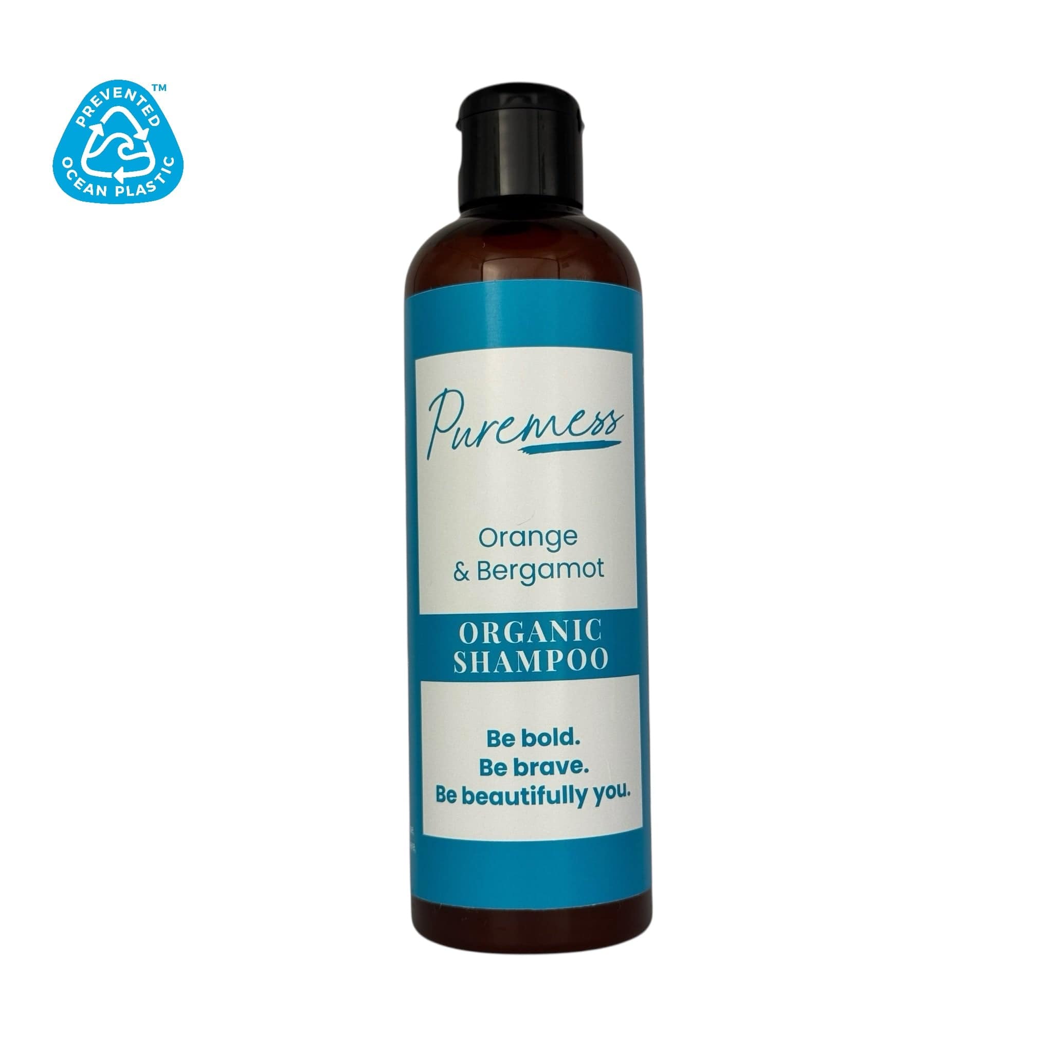 Amber plastic bottle with black flip cap, blue and cream label reading "Pureness Orange & Bergamot Organic Shampoo". - Orange & Bergamot Organic Shampoo