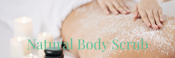 spa therapist rubbing salt scrub on woman's back