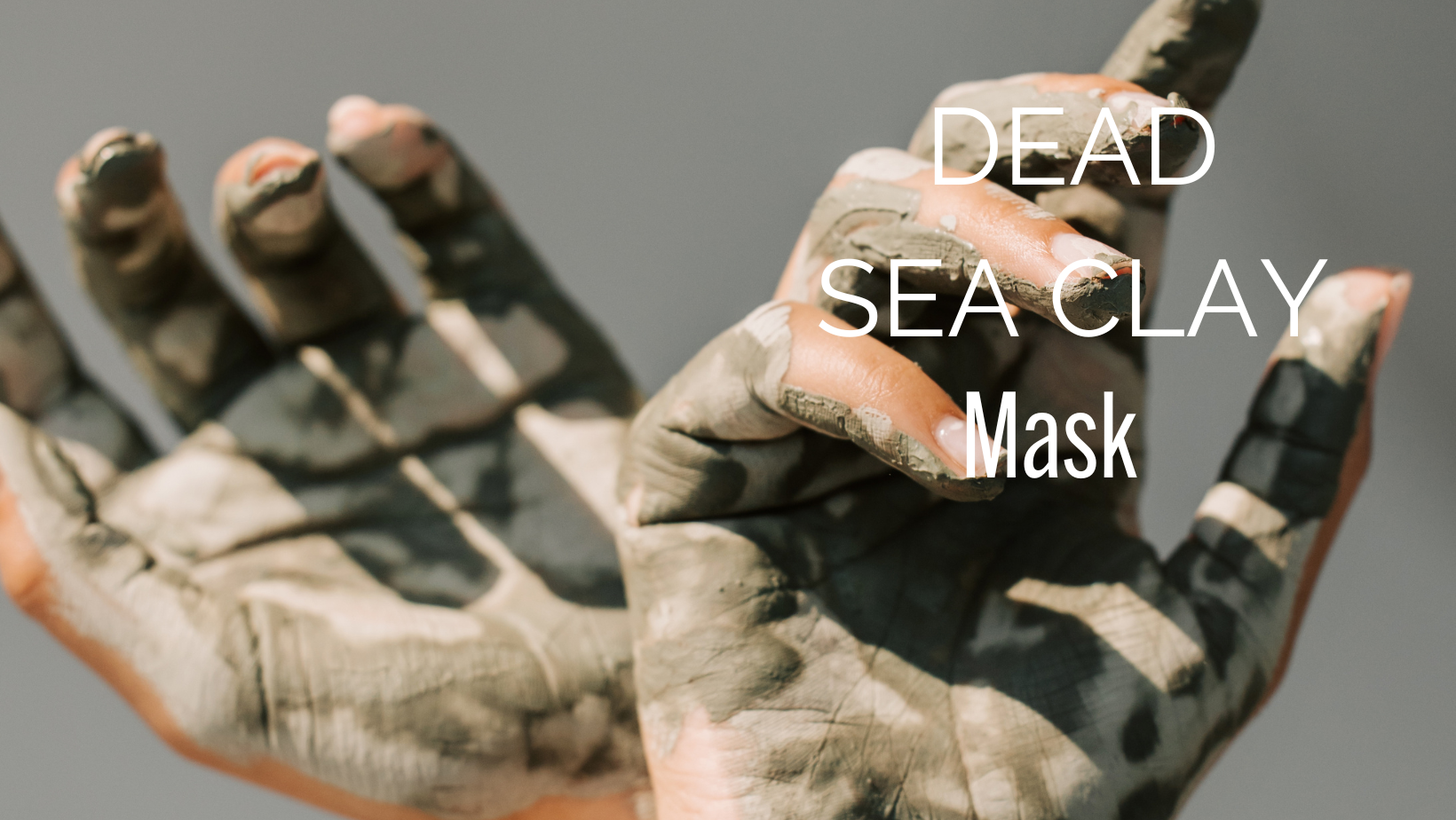 A pair of hands with dead sea clay drying on the palms