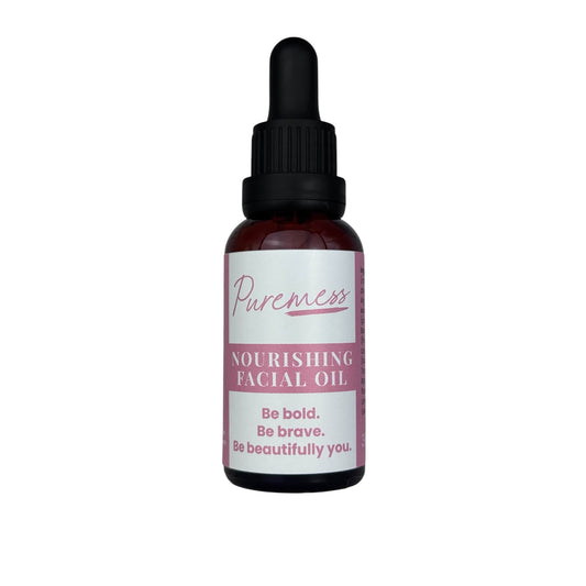 Dark amber dropper container labeled Puremess Nourishing Facial Oil with rosehip, argan, and pomegranate, eco-friendly. - Nourishing Facial Oil with Rosehip, Argan & Pomegranate – Natural & Vegan - PUREMESS SKINCARE
