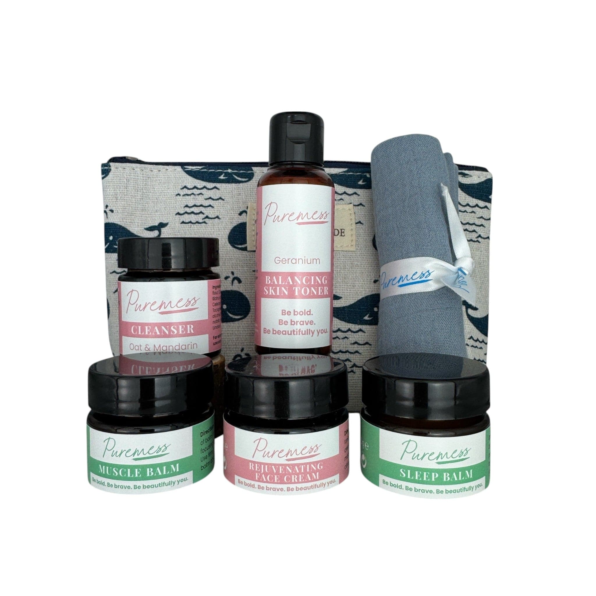 Set of three black jars with pastel-colored labels, a tall clear bottle with black cap, and a rolled blue-gray cloth, all. - Skincare & Wellness Essentials Set | Cleanse, Soothe & Glow On The Go